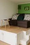 Salon douillet avec TV et canapé-lit